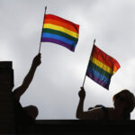 FILE PHOTO: People hold pride flags during the Gay Pride parade in Toronto July 1, 2012.    REUTERS/Mark Blinch